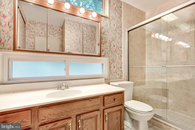 a view of backyard with seating area and green space