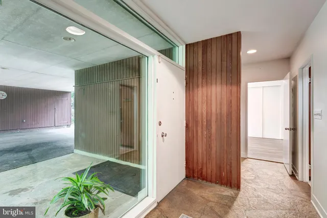 an aerial view of a house with a yard and lake view