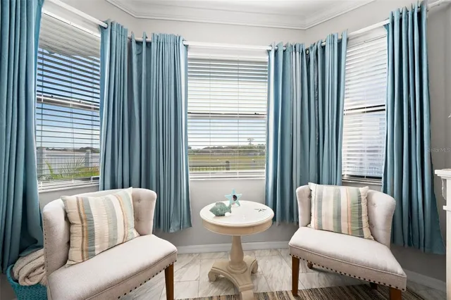 a view of walk in closet with clothes