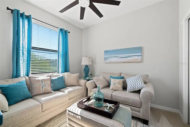 a living room with furniture and a window
