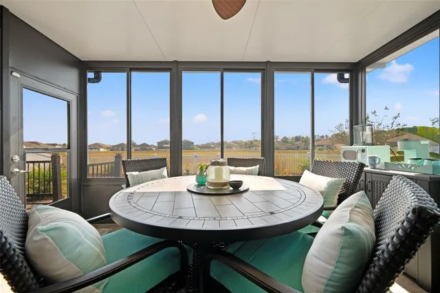 a view of a balcony with wooden floor and lake view