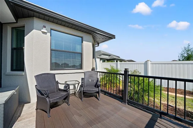 a view of a house with a yard and a patio