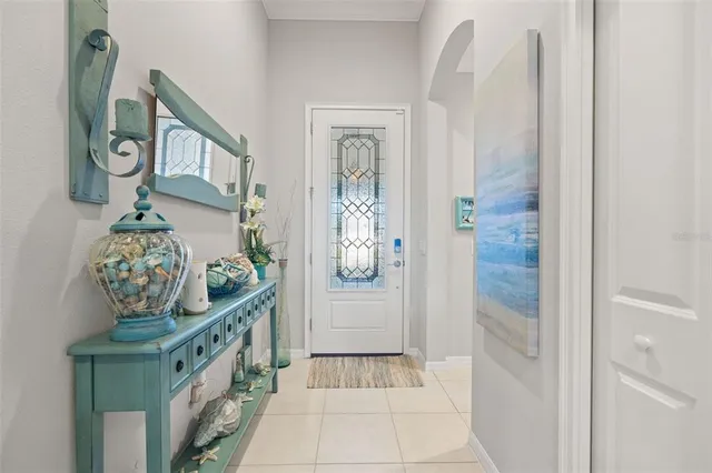 a living room with furniture and a view of kitchen
