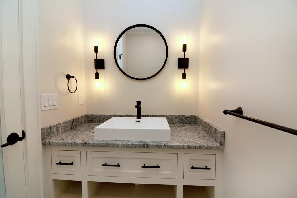 80 Fuller Brook Road Wellesley, MA 02482 - Photo 11 of 11 a bathroom with a granite countertop sink and a mirror