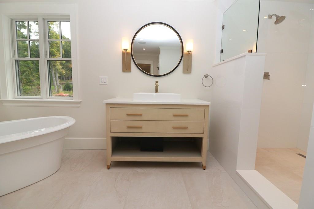 80 Fuller Brook Road Wellesley, MA 02482 - Photo 7 of 11 a bathroom with a sink a bathtub and a shower