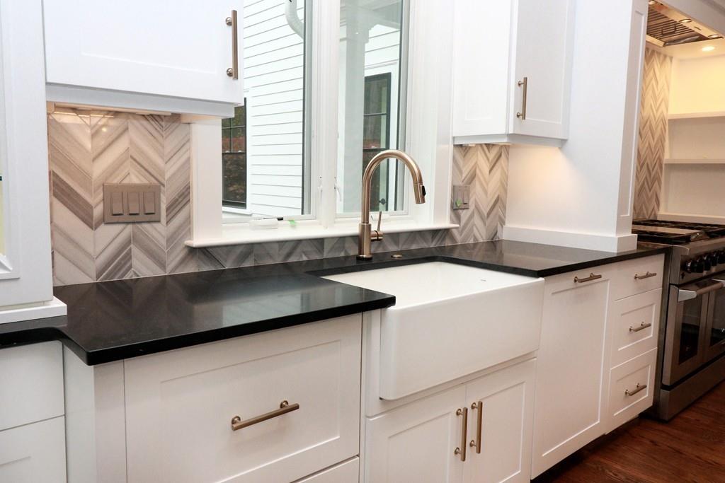 80 Fuller Brook Road Wellesley, MA 02482 - Photo 9 of 11 a kitchen with granite countertop a sink a stove and cabinets