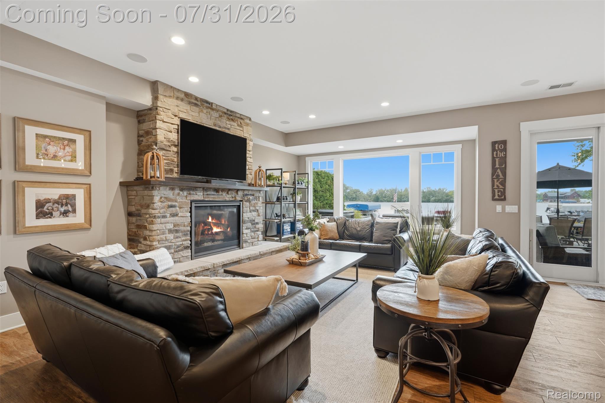 8303 Hilton Road Brighton, MI 48114 - Photo 43 of 72 lower level family room with gas stone fireplace