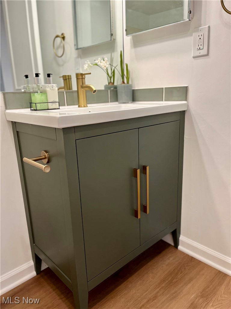 22701 Center Ridge Road, Unit 201 Rocky River, OH 44116 - Photo 23 of 37 Bathroom with vanity and hardwood / wood-style floors