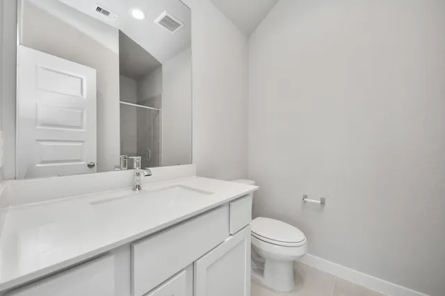 an empty room with fan and windows