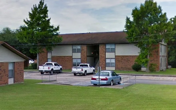 a house view with a sitting space and garden