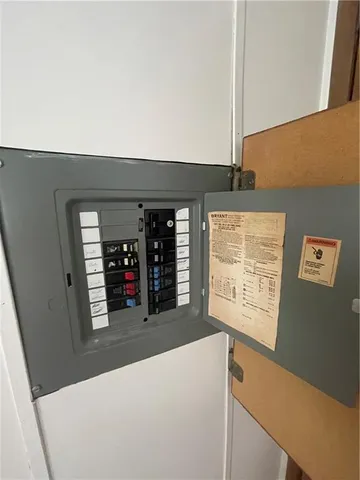 a view of a hallway with wooden floor and windows