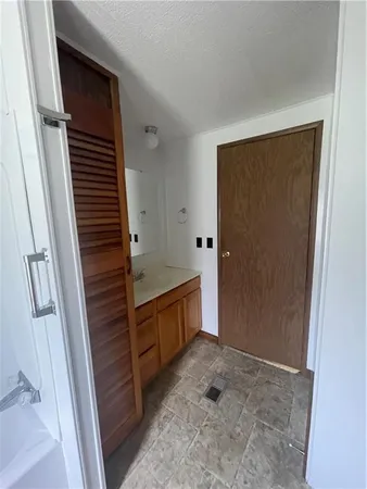 a view of bathroom with washer and dryer