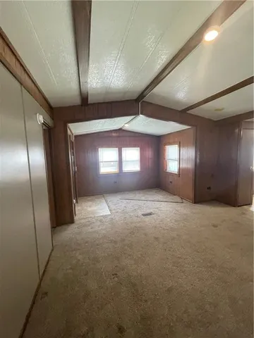 a view of wooden floor and windows in an empty room