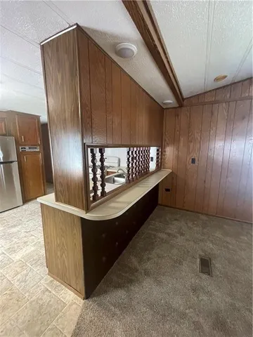 a view of a room with wooden walls