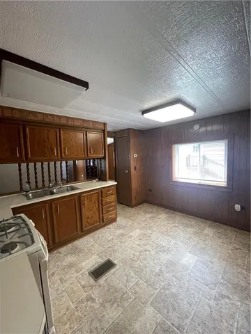 a view of a kitchen with furniture and window