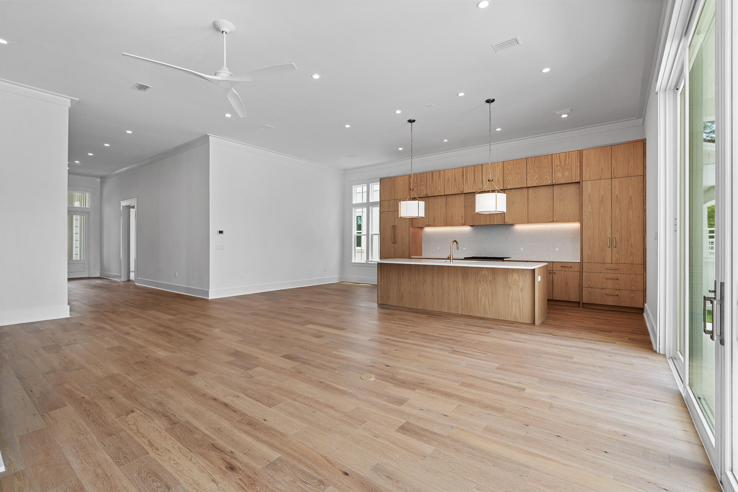 129 Pollard Cove West, Unit LOT 58 Watersound, FL 32461 - Photo 10 of 39 a view of a kitchen with a sink and a refrigerator