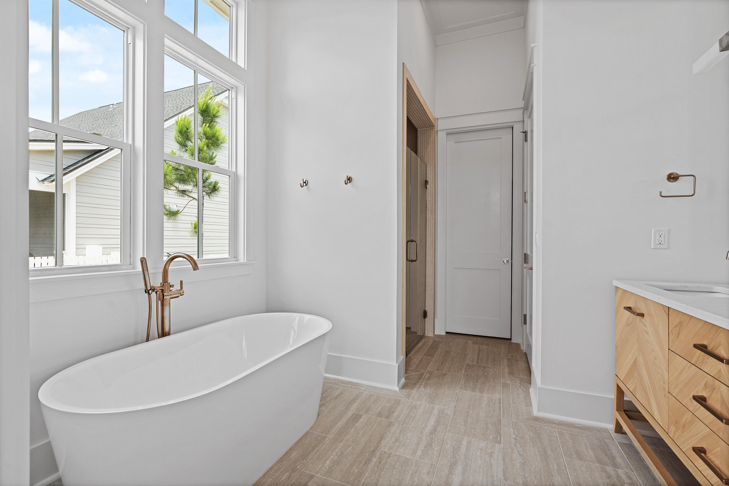 129 Pollard Cove West, Unit LOT 58 Watersound, FL 32461 - Photo 16 of 39 a white tub sitting next to a window