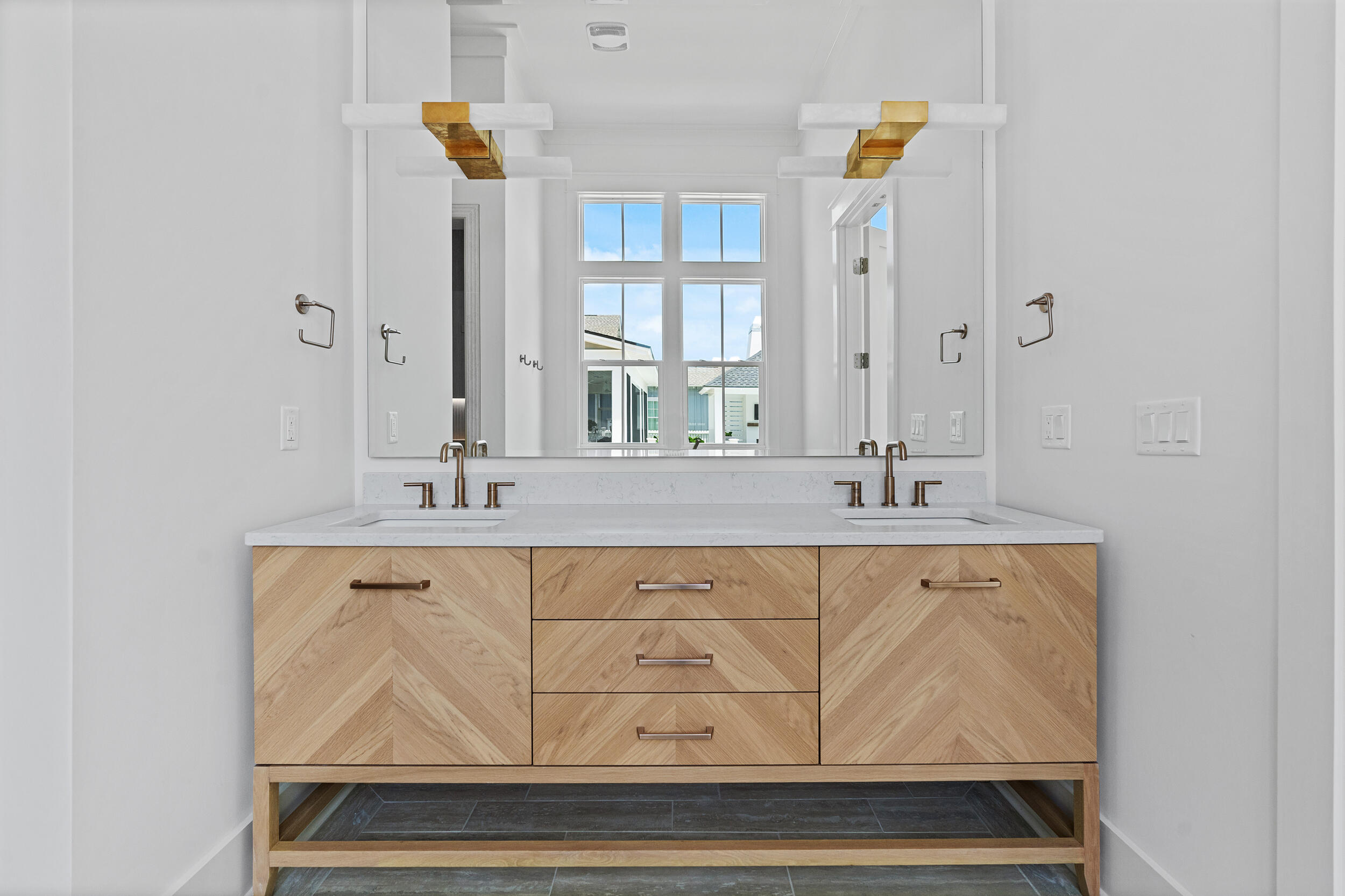 129 Pollard Cove West, Unit LOT 58 Watersound, FL 32461 - Photo 17 of 39 a bathroom with a sink and a mirror