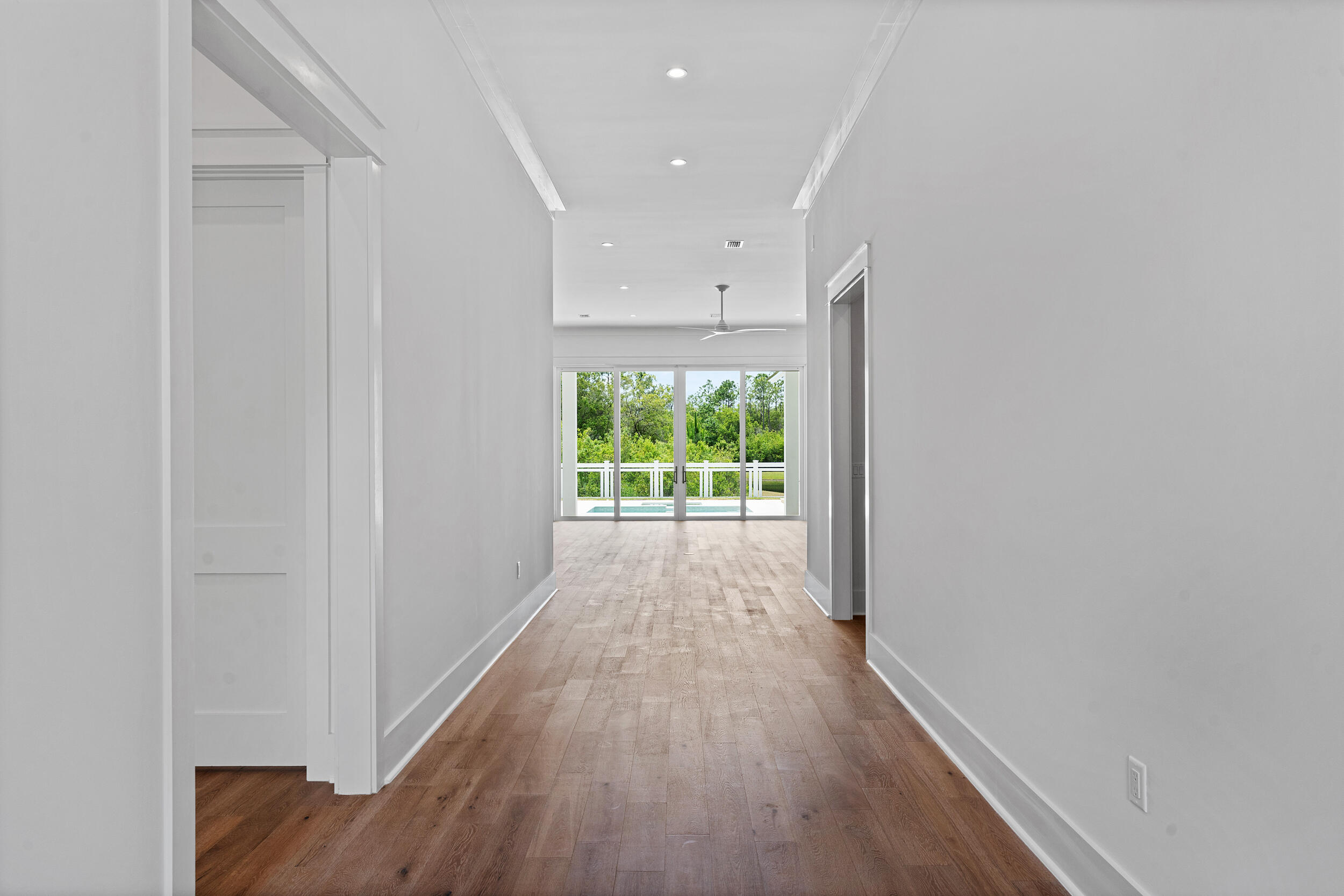129 Pollard Cove West, Unit LOT 58 Watersound, FL 32461 - Photo 4 of 39 a view of a hallway with wooden floor and a window
