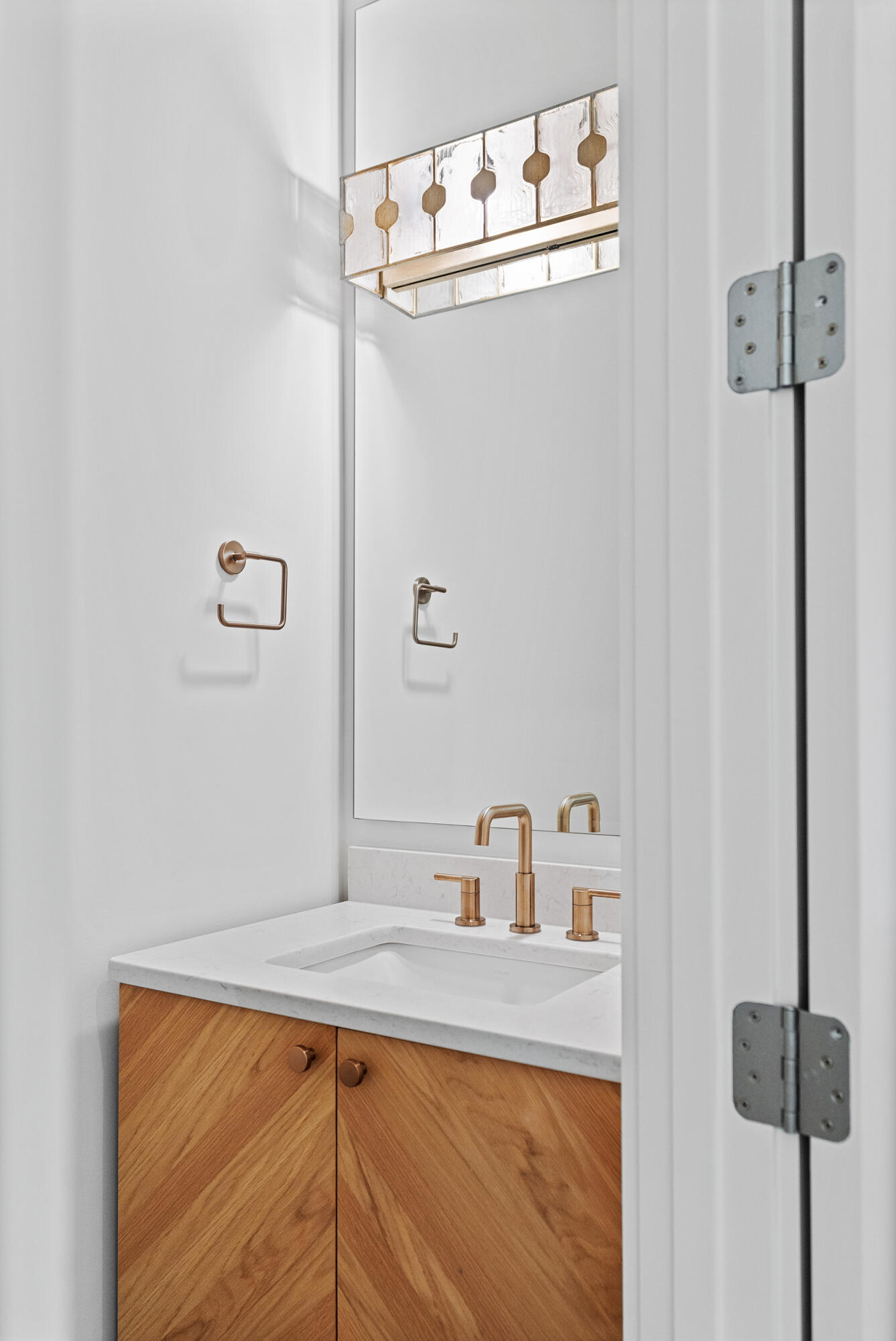 129 Pollard Cove West, Unit LOT 58 Watersound, FL 32461 - Photo 5 of 39 a bathroom with a sink and a mirror