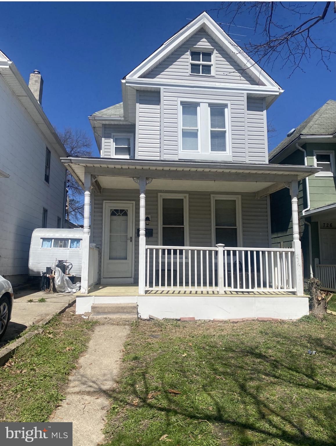 724 East 35th Street Baltimore, MD 21218 - Photo 1 of 13 a front view of a house with a porch