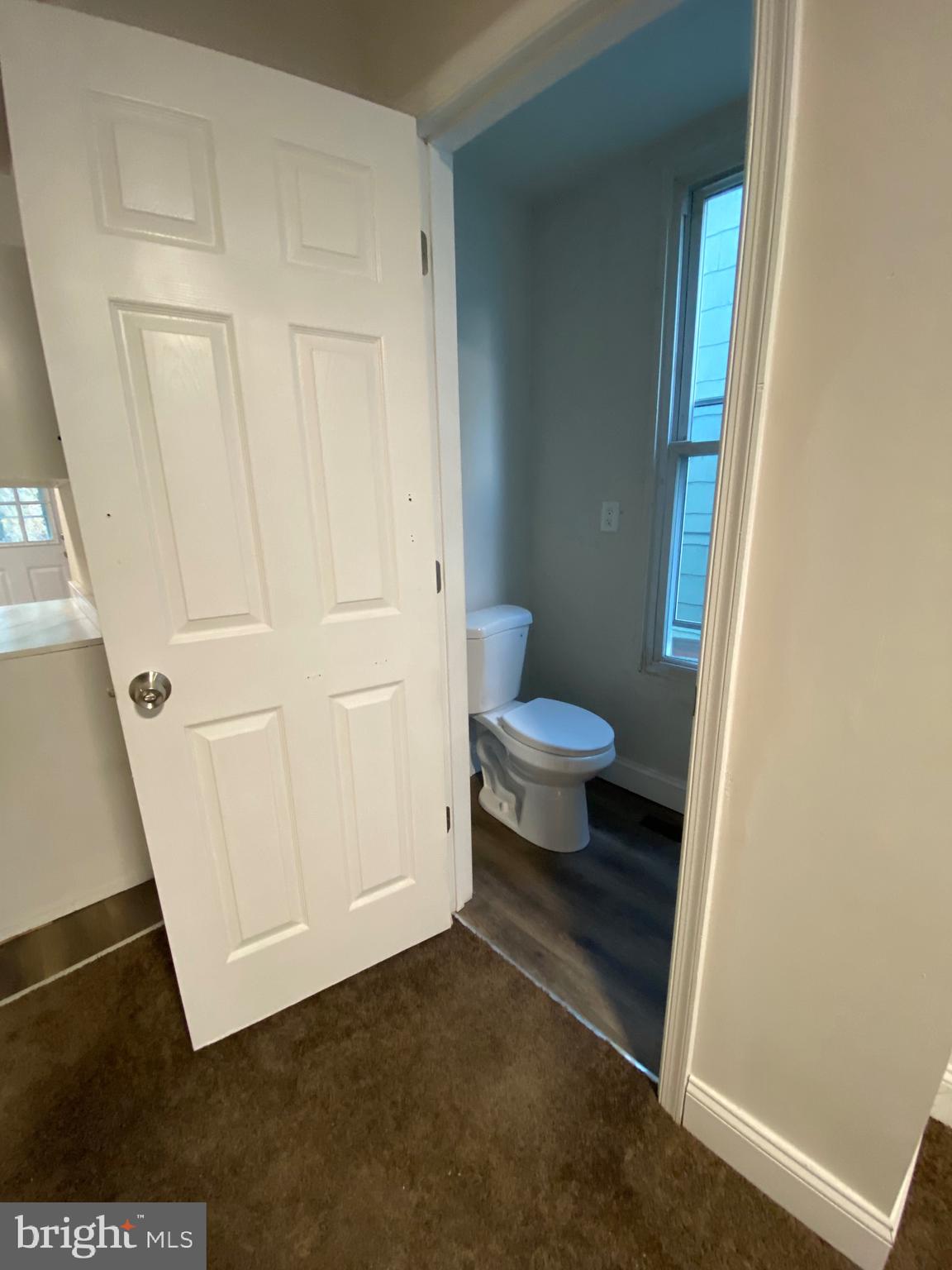 724 East 35th Street Baltimore, MD 21218 - Photo 12 of 13 a bathroom with a sink and a toilet