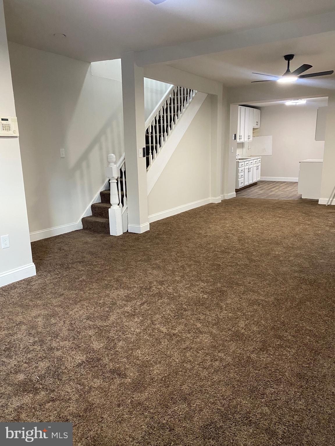 724 East 35th Street Baltimore, MD 21218 - Photo 3 of 13 a view of an empty room with stairs