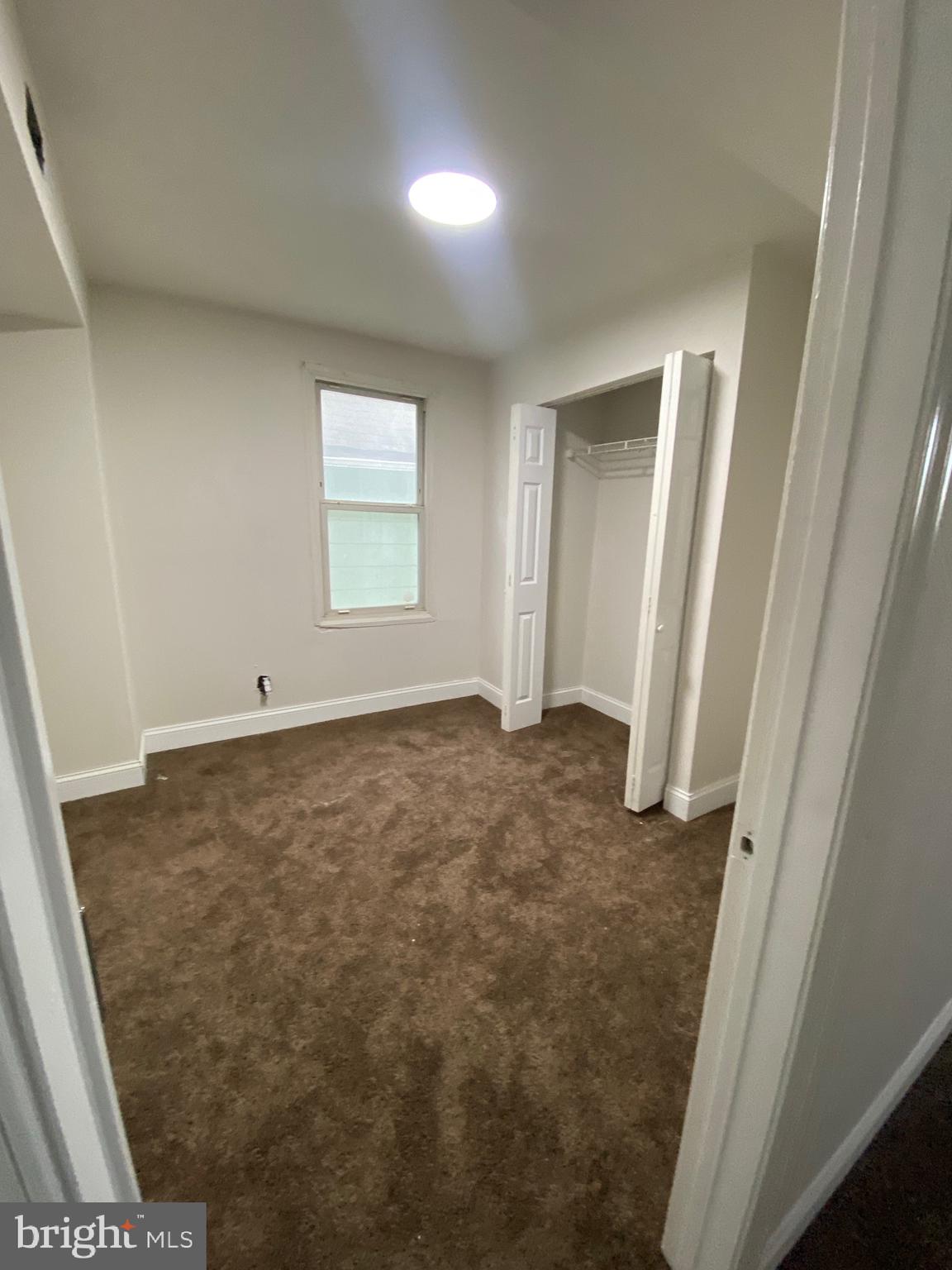 724 East 35th Street Baltimore, MD 21218 - Photo 9 of 13 an empty room with a bench