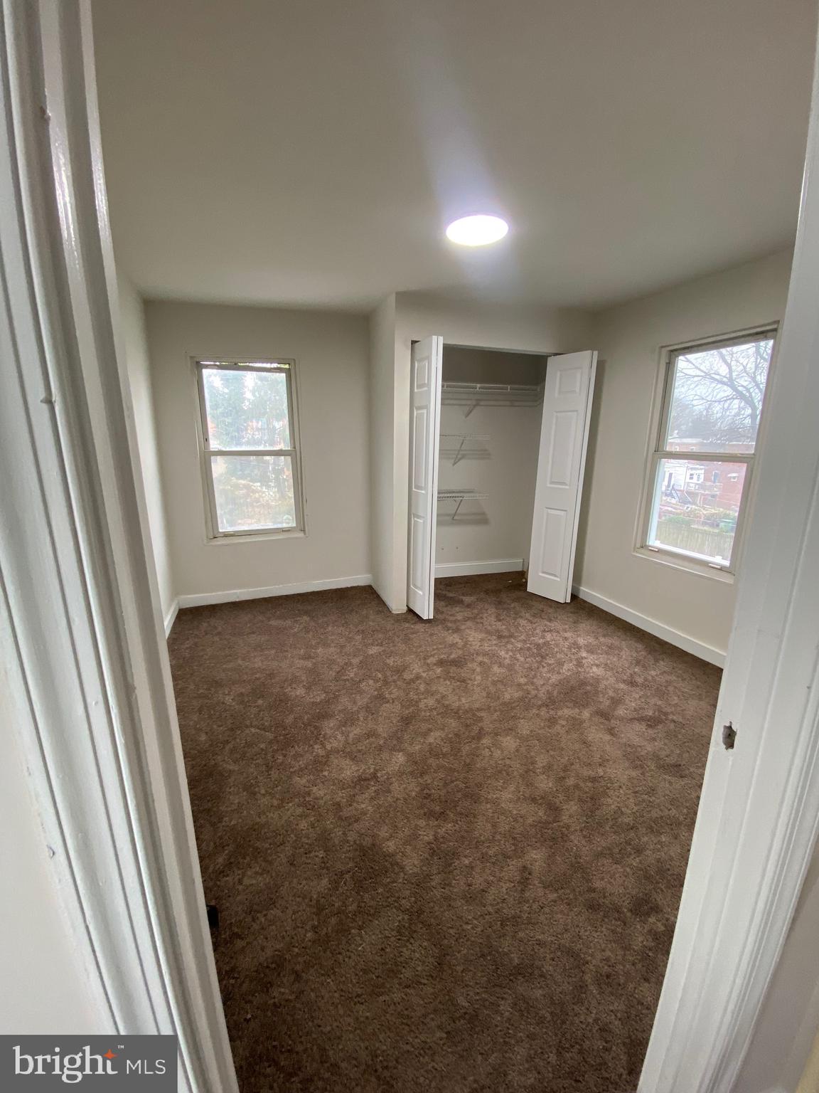 724 East 35th Street Baltimore, MD 21218 - Photo 10 of 13 an empty room with windows