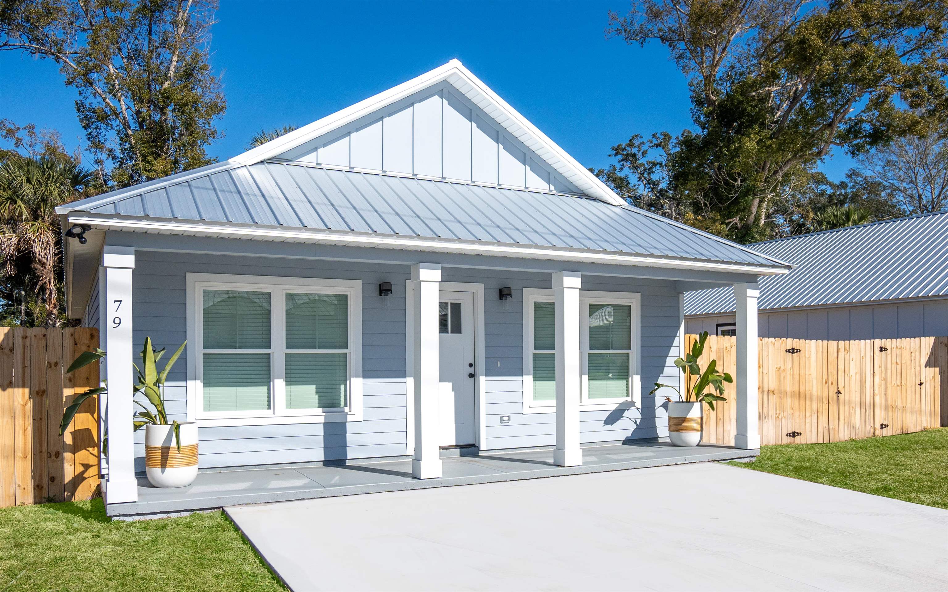 a front view of a house with a yard and porch