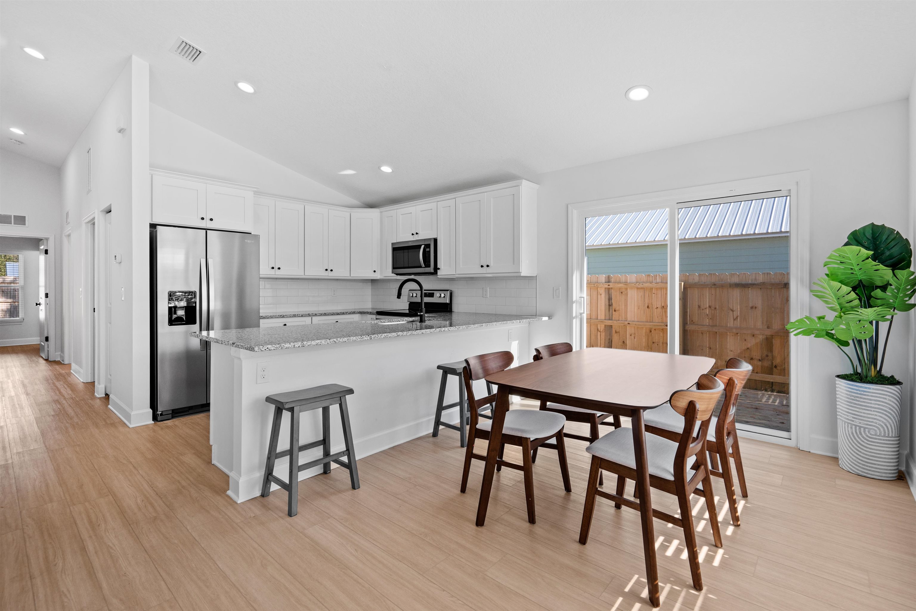 79 Helen Street St. Augustine, FL 32084 - Photo 11 of 33 a kitchen with a table and chairs in it