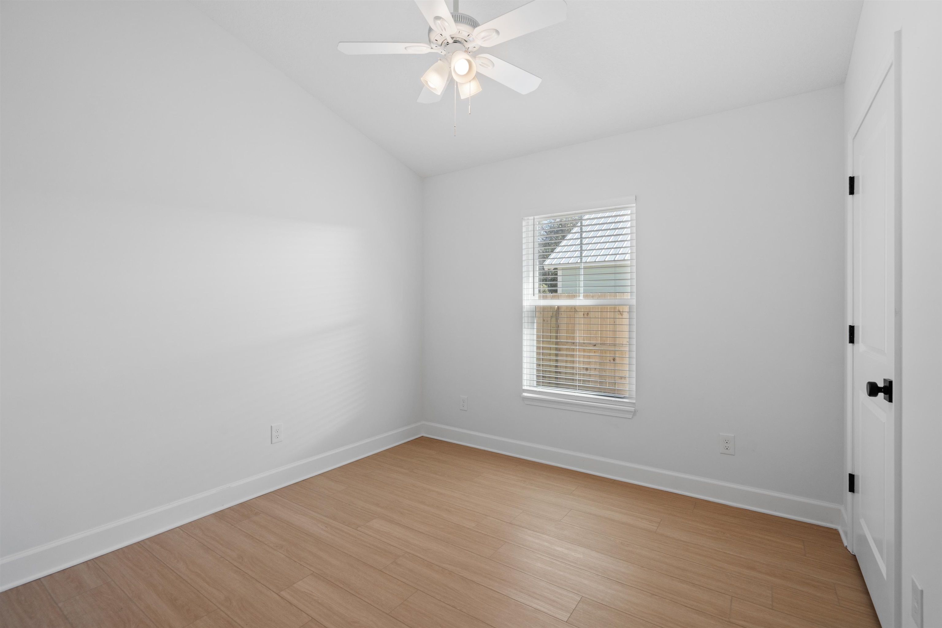 79 Helen Street St. Augustine, FL 32084 - Photo 14 of 33 wooden floor in an empty room with a window