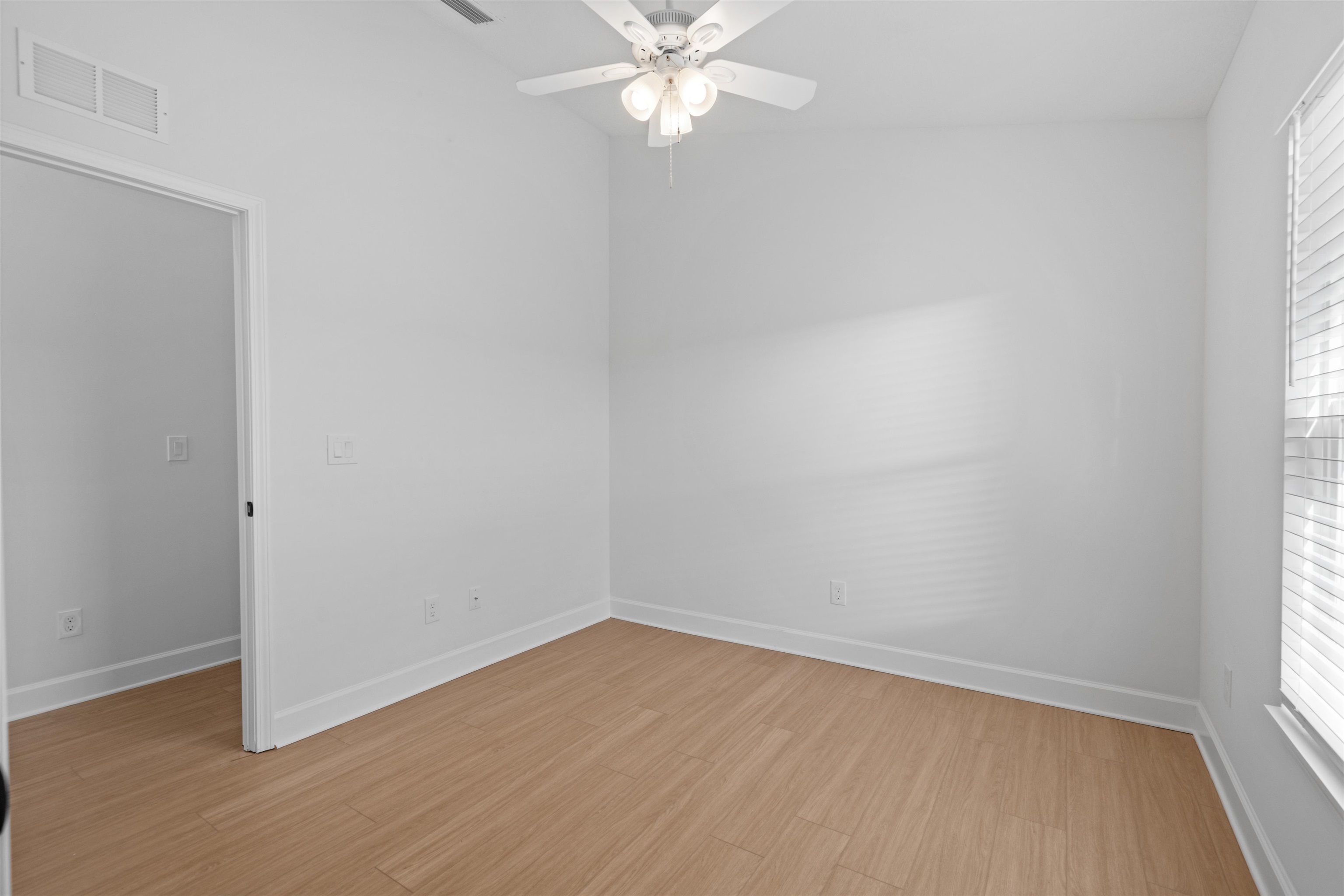 79 Helen Street St. Augustine, FL 32084 - Photo 16 of 33 an empty room with a window and a fan