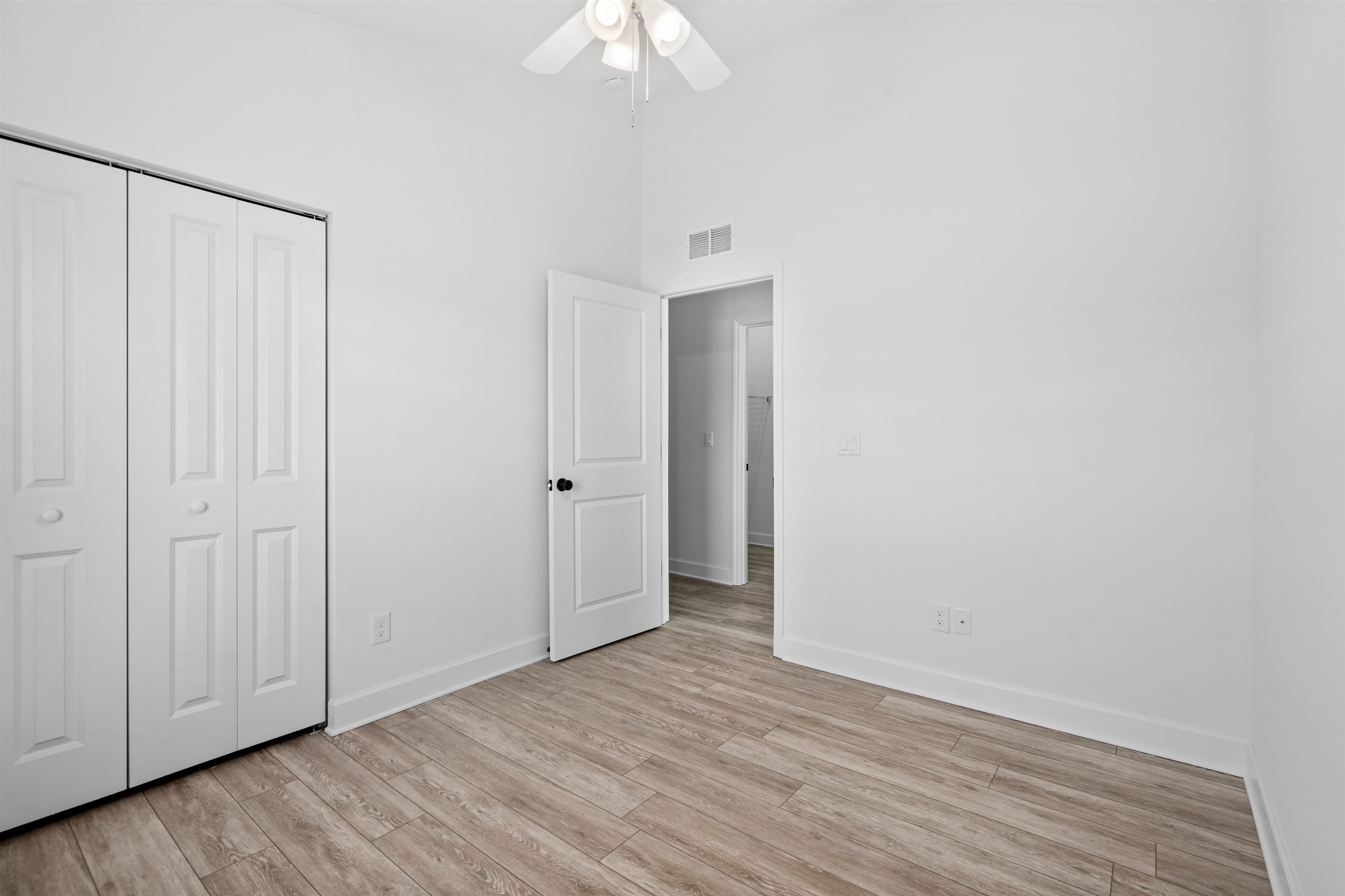 79 Helen Street St. Augustine, FL 32084 - Photo 24 of 33 a view of an empty room with wooden floor