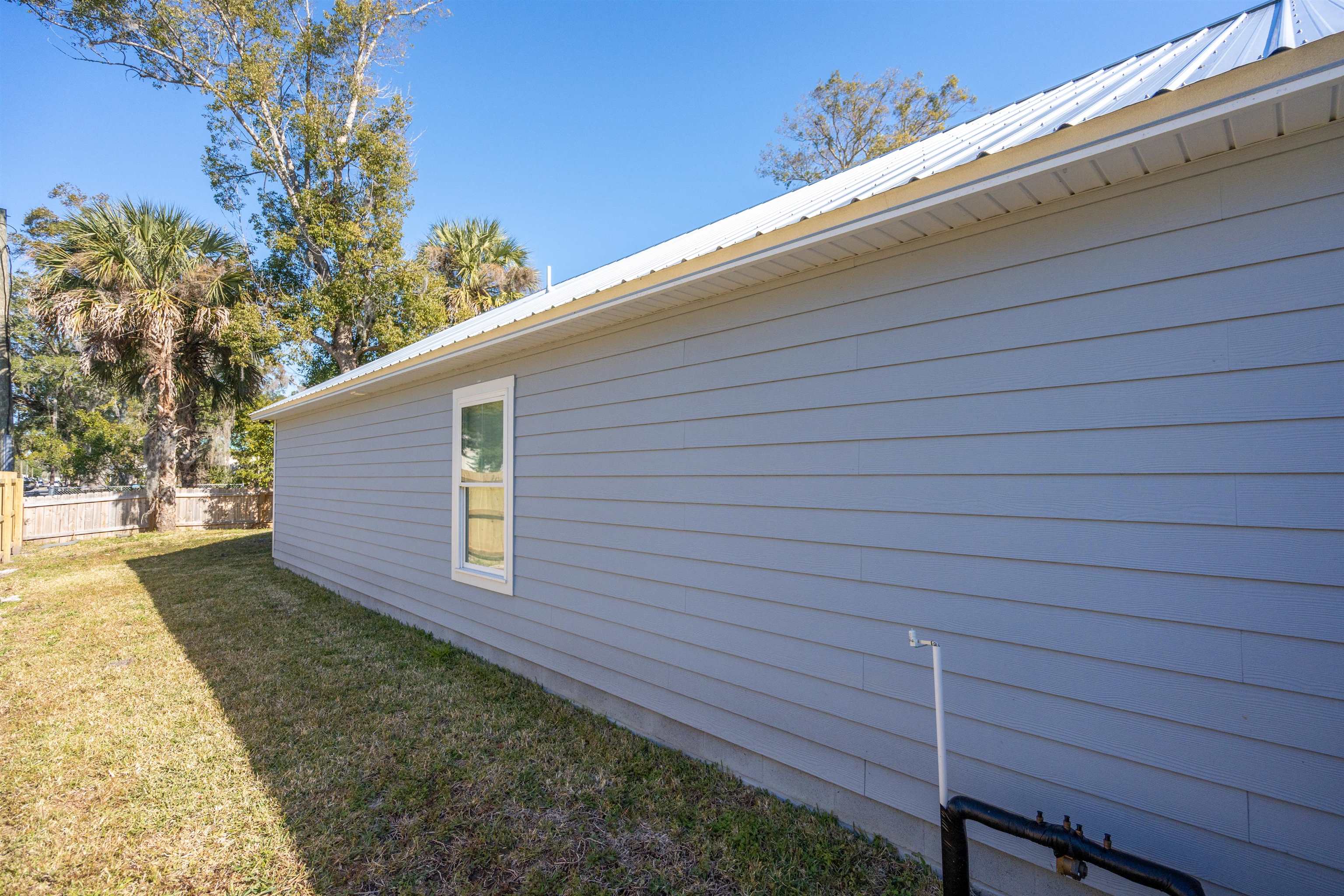 79 Helen Street St. Augustine, FL 32084 - Photo 30 of 33 a backyard of a house