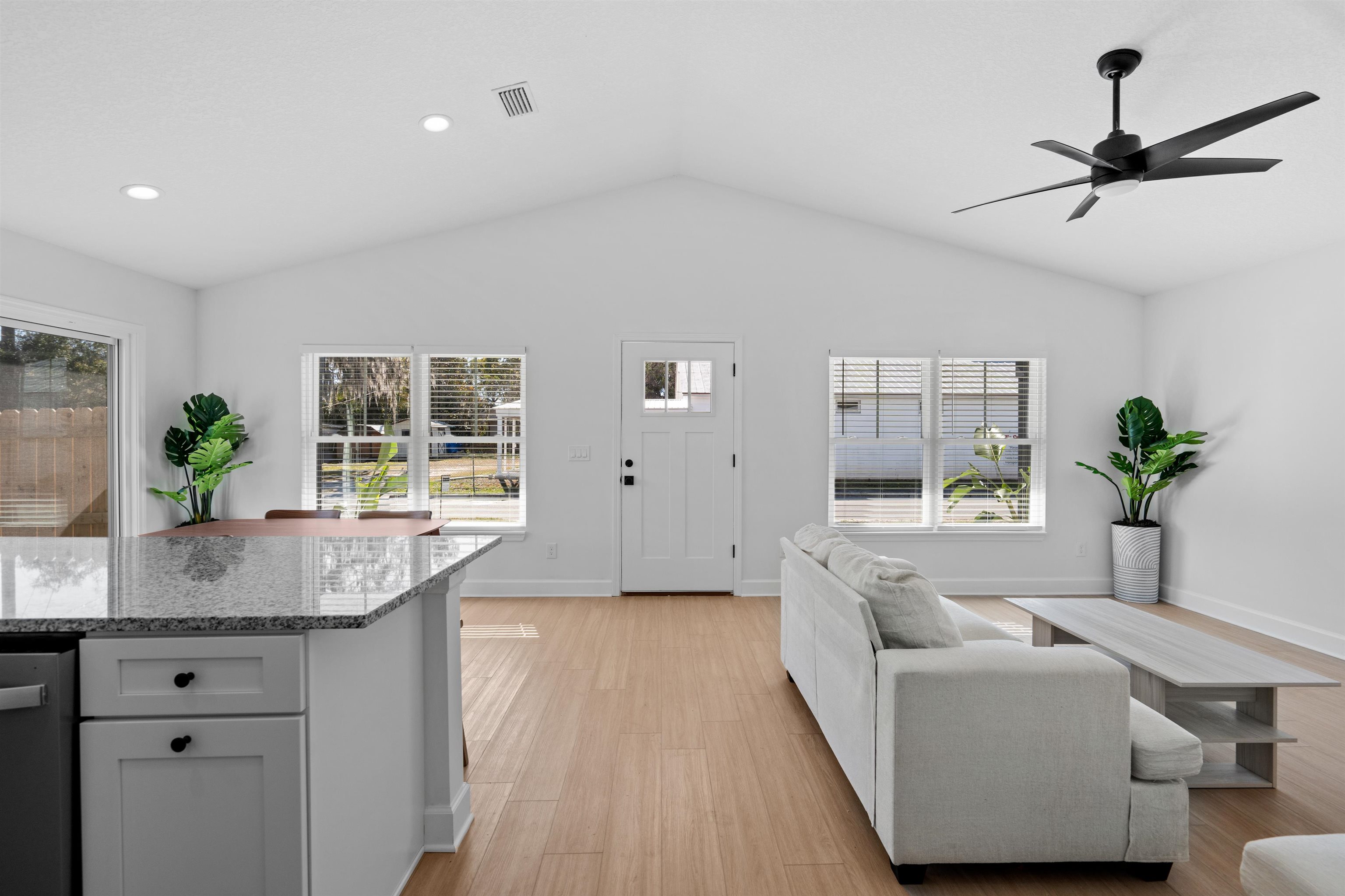 79 Helen Street St. Augustine, FL 32084 - Photo 5 of 33 a living room with stainless steel appliances granite countertop furniture and a potted plant