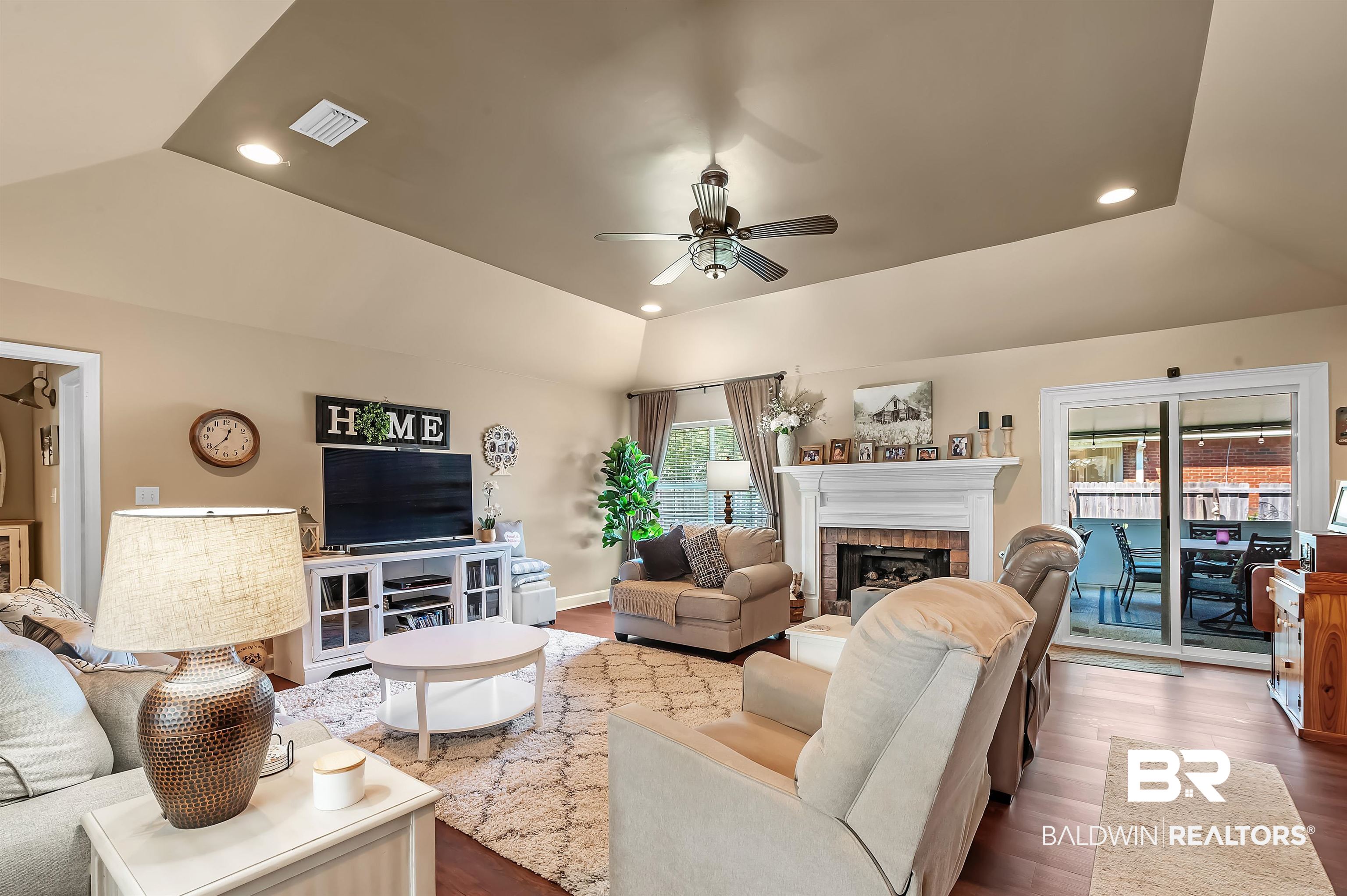 9901 Glover Court Fairhope, AL 36532 - Photo 4 of 52 Living room with hardwood / wood-style flooring, ceiling fan, and a wealth of natural light