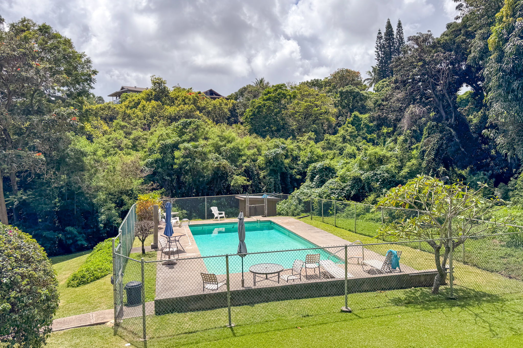 4701 Kawaihau Road, Unit C201 Kapaa, HI 96746 - Photo 17 of 28 a view of a tennis ground with a small pool