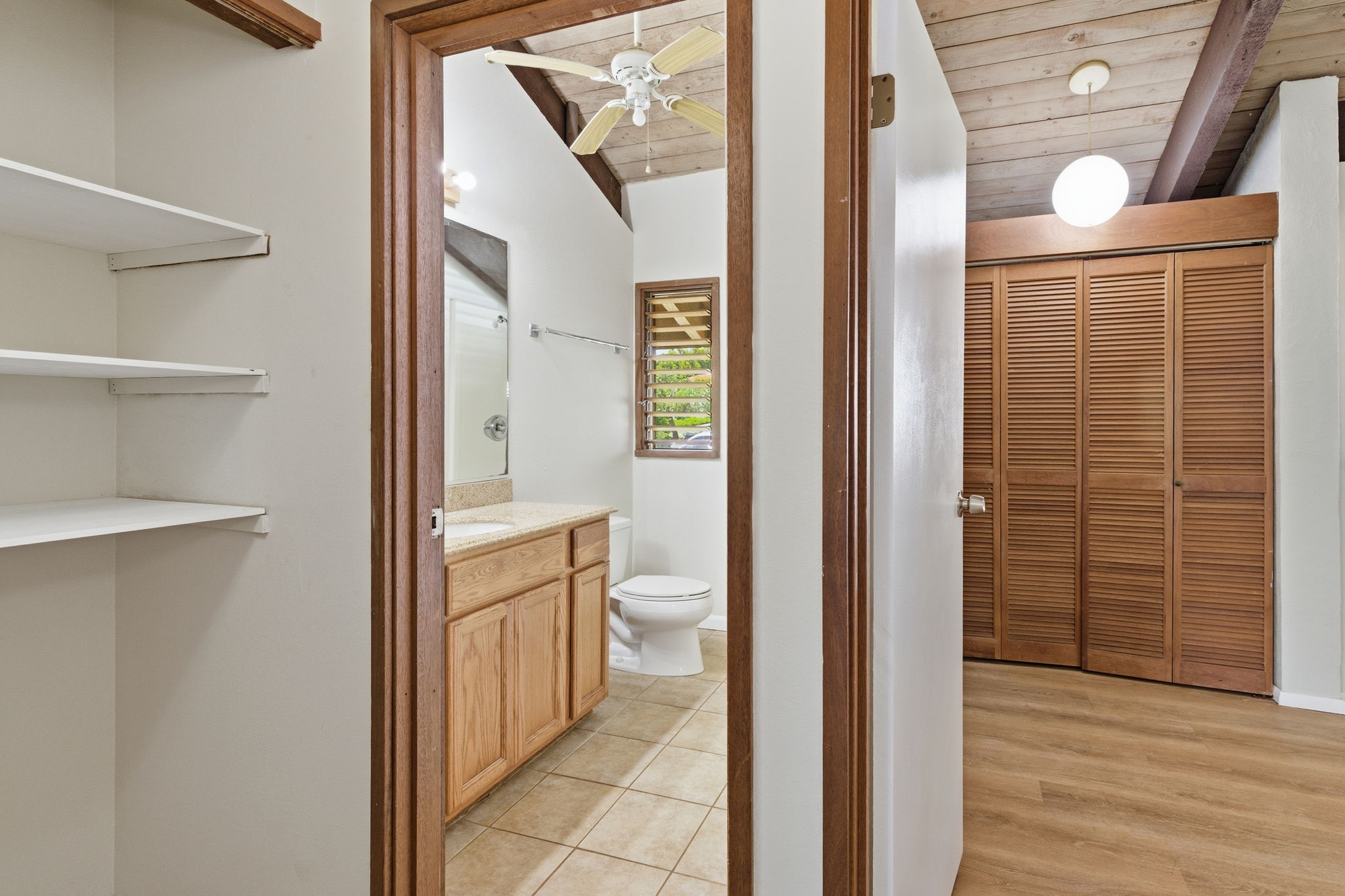 4701 Kawaihau Road, Unit C201 Kapaa, HI 96746 - Photo 20 of 28 a bathroom with a sink and a mirror