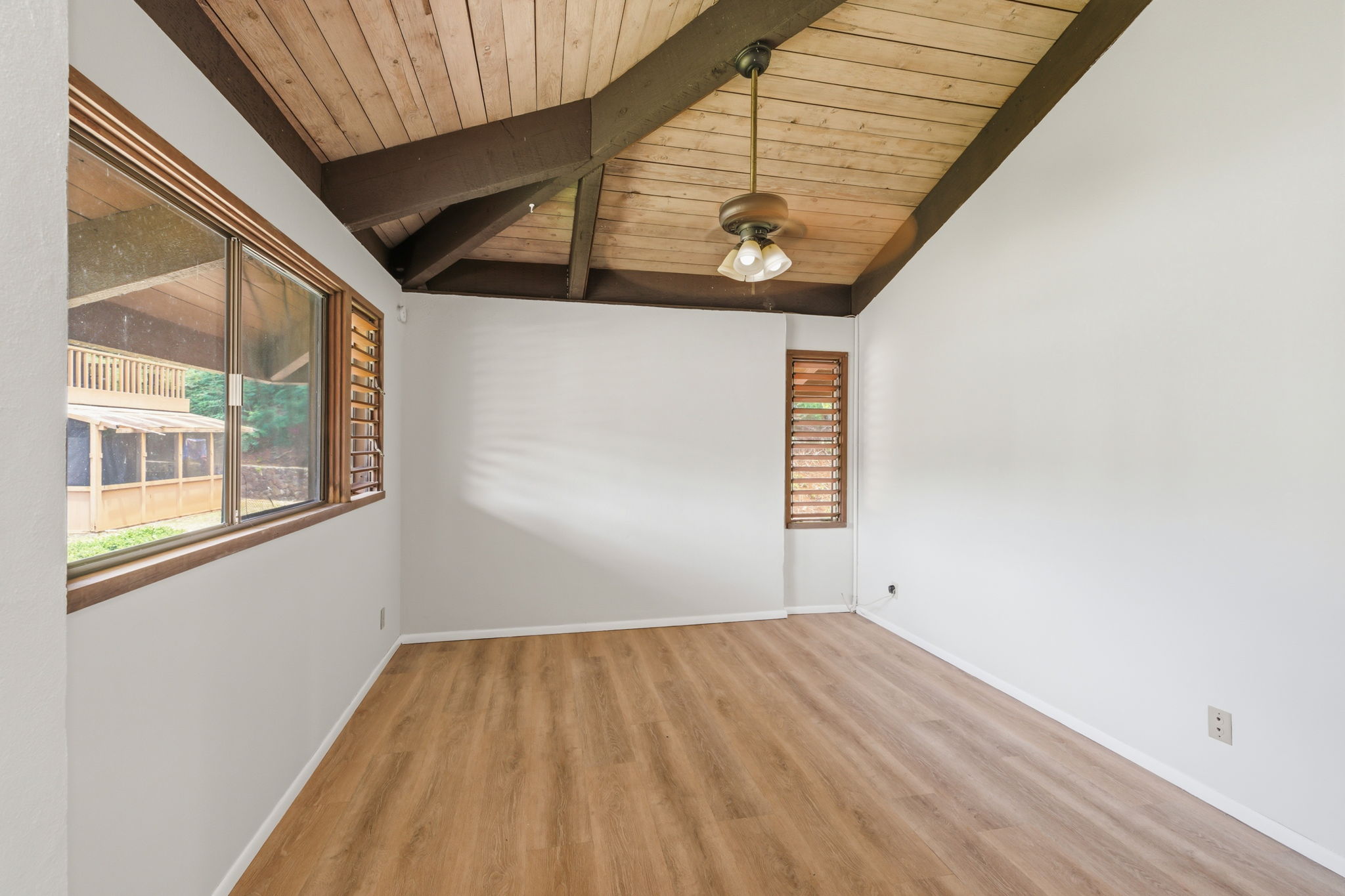 4701 Kawaihau Road, Unit C201 Kapaa, HI 96746 - Photo 21 of 28 a view of a room with wooden floor and windows