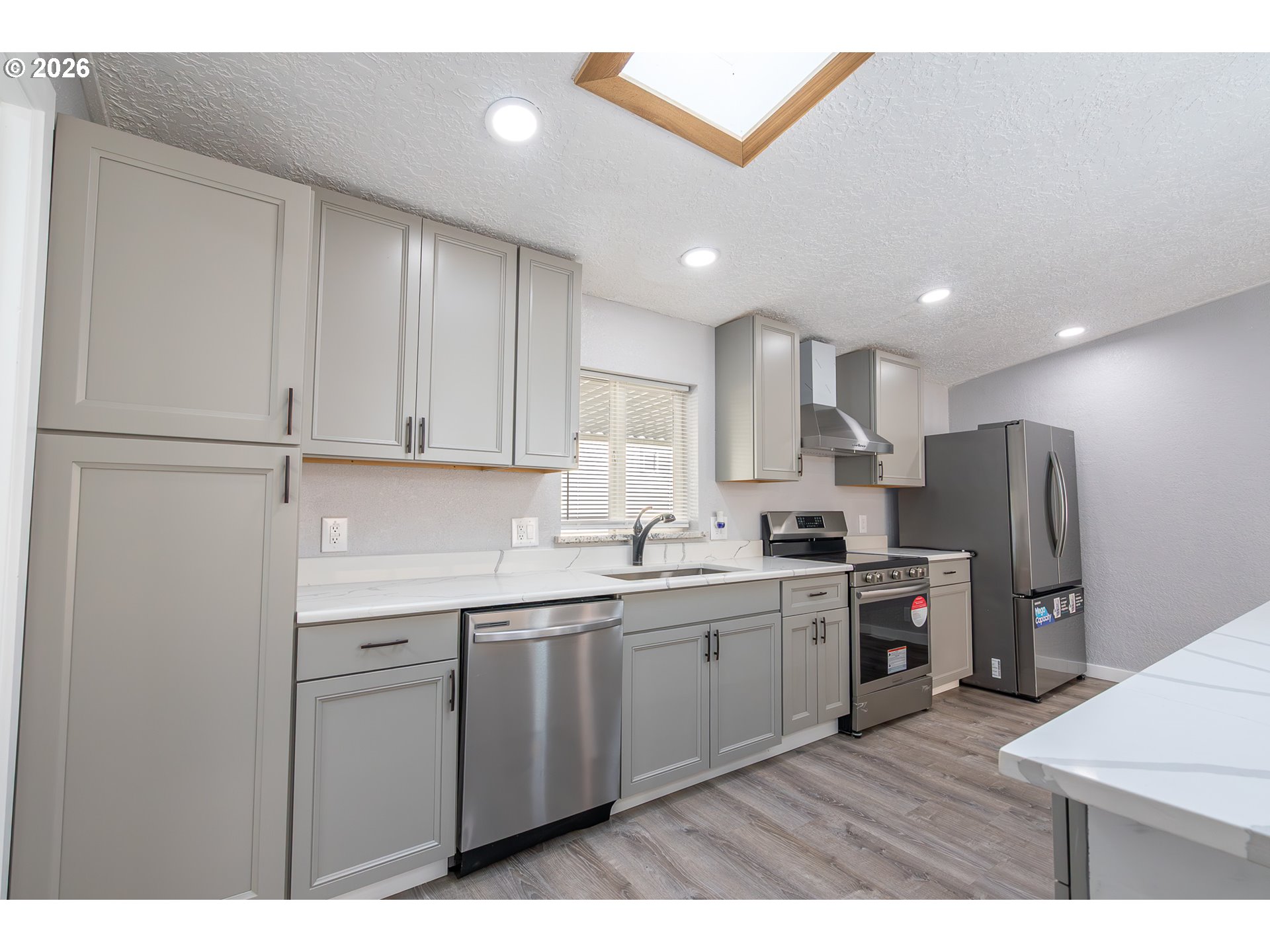 3554 Turner Road Southeast Salem, OR 97302 - Photo 11 of 20 a kitchen with stainless steel appliances granite countertop a sink a stove a refrigerator and cabinets