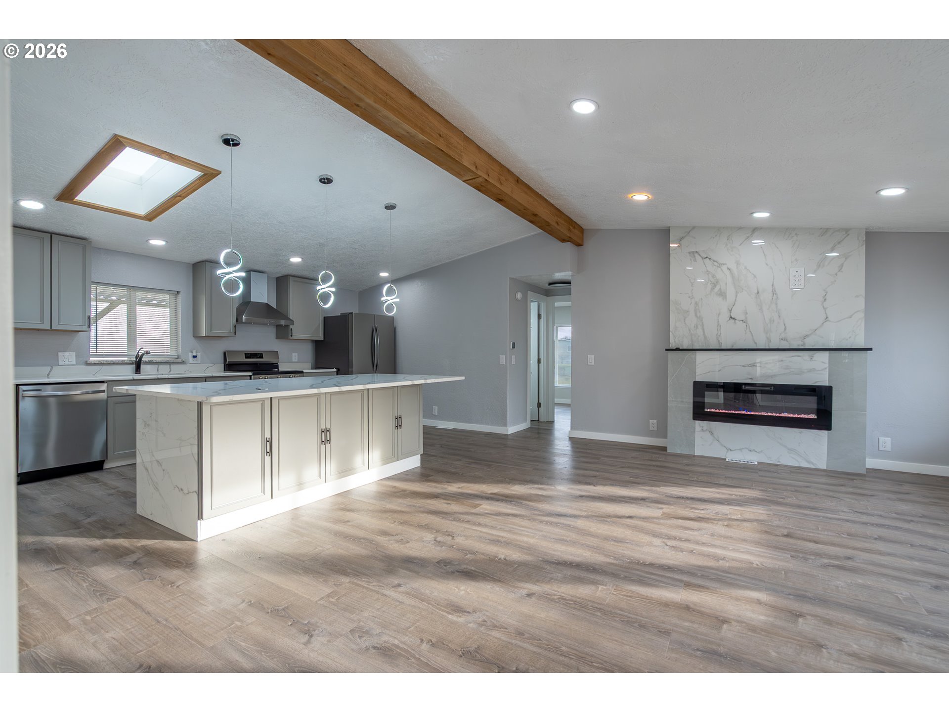 3554 Turner Road Southeast Salem, OR 97302 - Photo 6 of 20 a view of kitchen with kitchen island granite countertop a stove top oven a sink and a counter top space