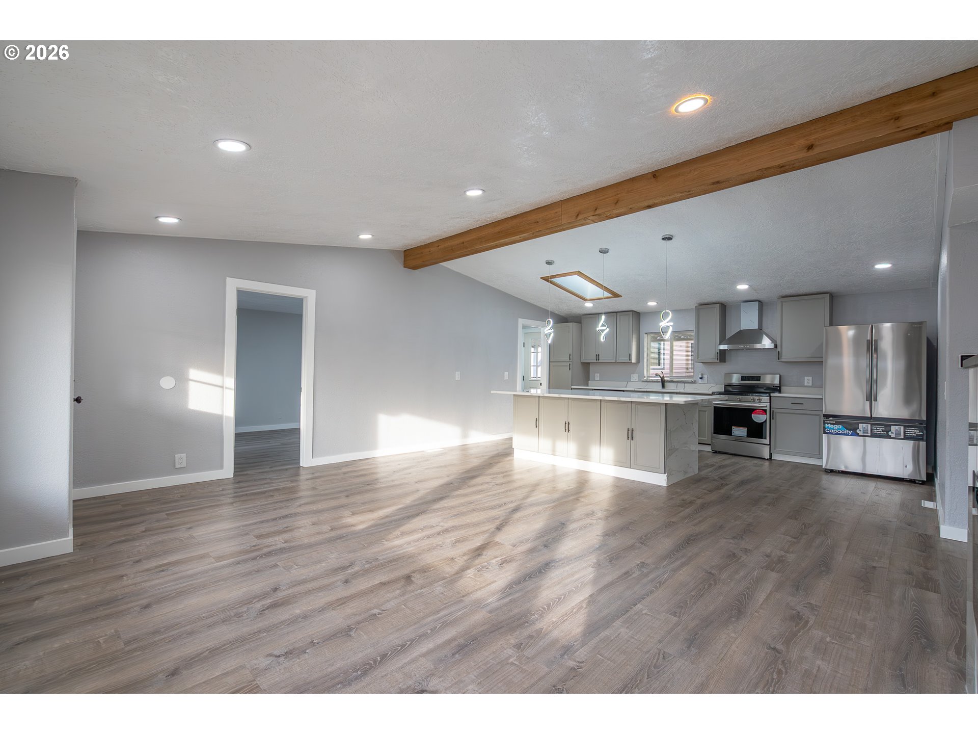 3554 Turner Road Southeast Salem, OR 97302 - Photo 7 of 20 a view of kitchen with kitchen island wooden floor center island and stainless steel appliances