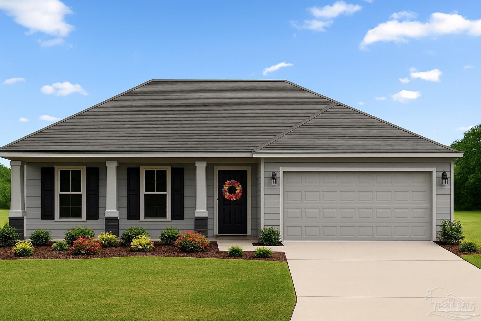 a front view of a house with a garden and plants
