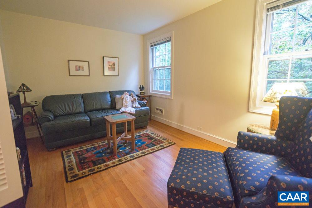 2040 Thomson Road Charlottesville, VA 22903 - Photo 14 of 23 a living room with furniture and a window