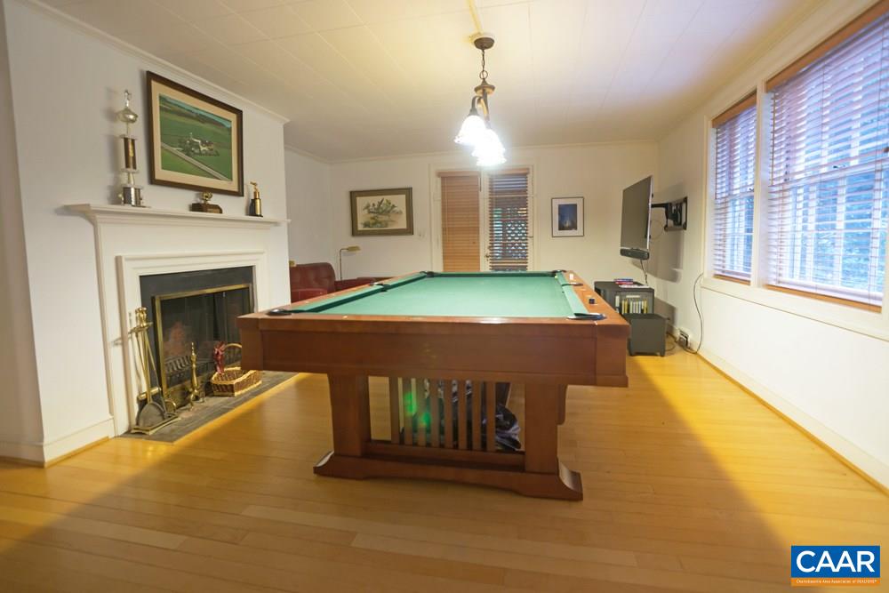 2040 Thomson Road Charlottesville, VA 22903 - Photo 18 of 23 a living room with furniture and a fireplace