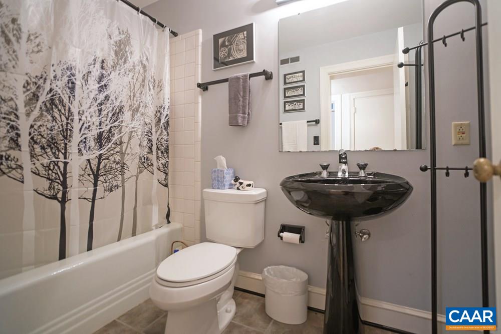 2040 Thomson Road Charlottesville, VA 22903 - Photo 23 of 23 a bathroom with a sink toilet and a mirror