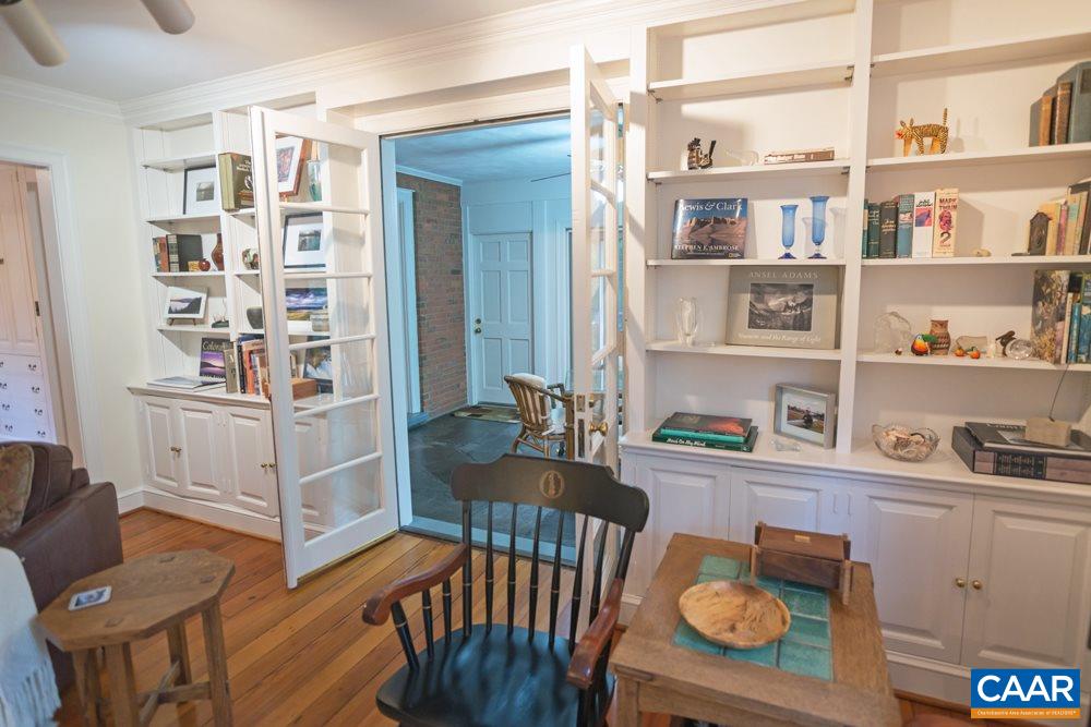 2040 Thomson Road Charlottesville, VA 22903 - Photo 5 of 23 a bedroom with furniture and a book shelf