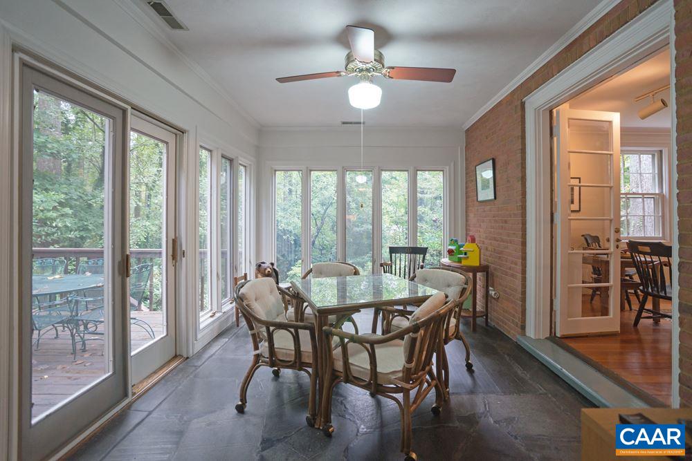 2040 Thomson Road Charlottesville, VA 22903 - Photo 6 of 23 a dining room with furniture a chandelier and wooden floor