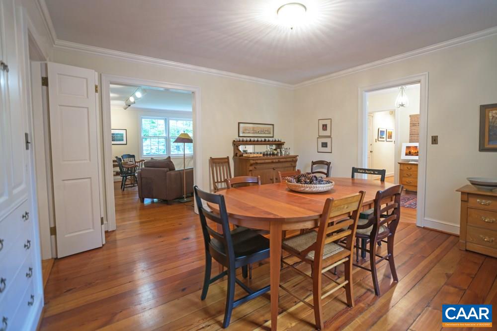 2040 Thomson Road Charlottesville, VA 22903 - Photo 7 of 23 a view of a dining room with furniture and wooden floor